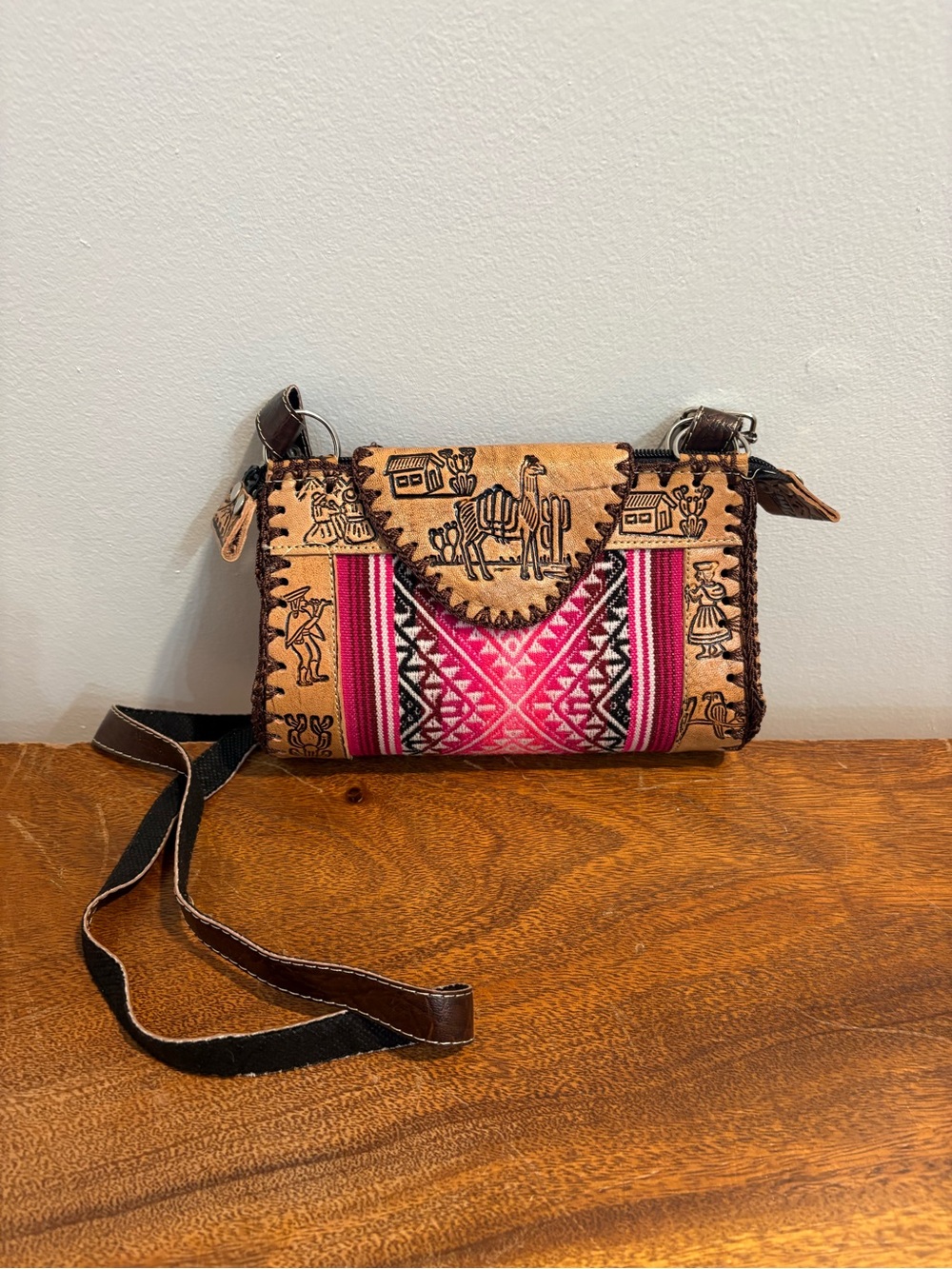 Artisan Hand-Tooled Leather Crossbody Bag with Pink Textile Accent